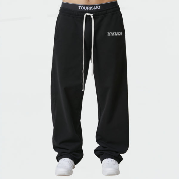 Jogging Tourismo noir vue face avec broderie logo sur la taille