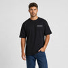 T-shirt Back To The Future noir vu de face en plan rapproché avec logo Tourismo